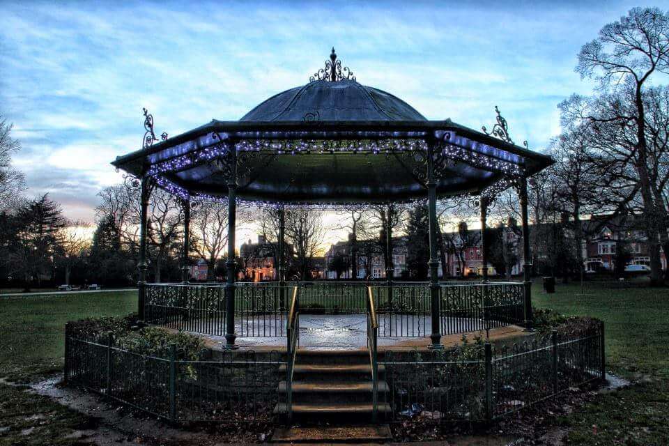 An old fashioned bandstand in the middle of a park